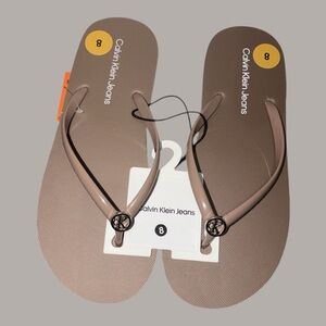 Calvin Klein Tan Flip Flops​